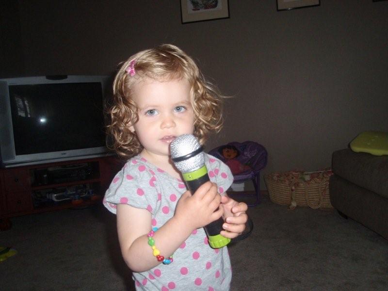Molly practicing Karaoke to "Elmo's Song"