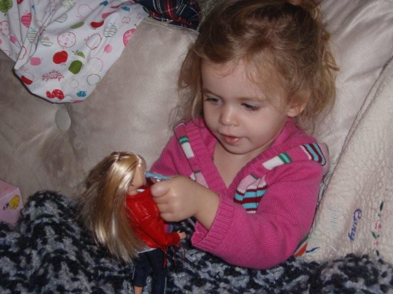Molly helping her doll put on a concert :)