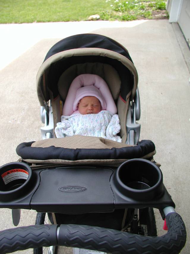 All set for the first walk in the stroller.
