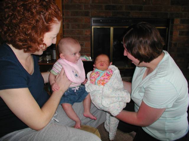 Molly meets Chloe for the first time, wait I thing the moms are holding the wrong babies :)